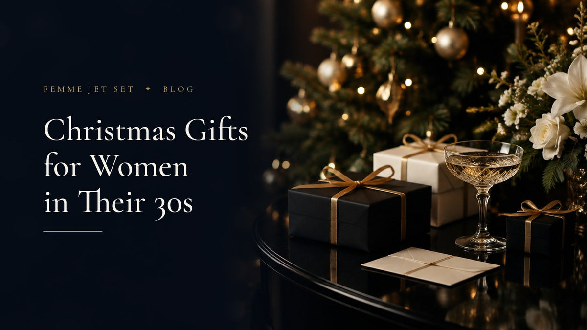 Black and ivory wrapped gifts with gold ribbons and a champagne coupe beside a lit Christmas tree, Christmas Gift Ideas for Women in Their 30s cover