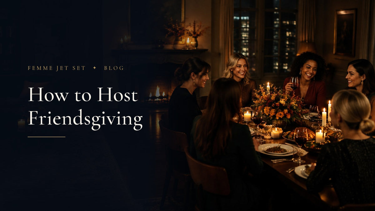 Women friends laughing around a candlelit Friendsgiving dinner table with autumn flowers in an elegant New York apartment, How to Host Friendsgiving cover