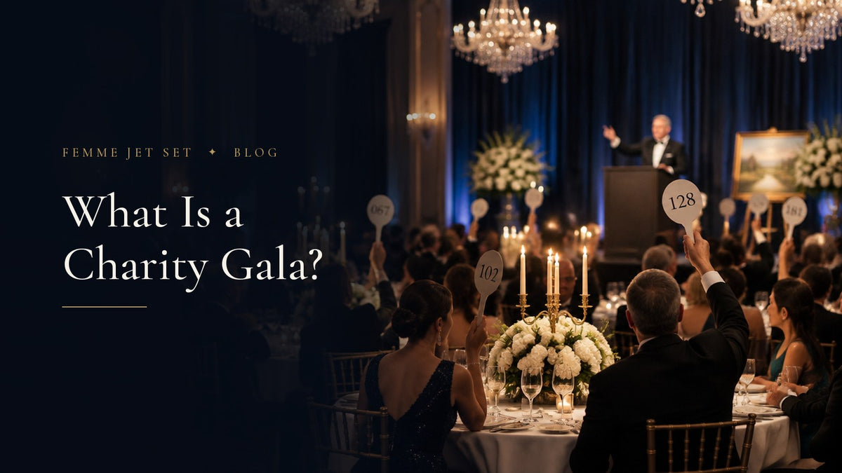 Guests in black tie raising numbered bidding paddles at a candlelit charity gala dinner in a hotel ballroom, What Is a Charity Gala cover
