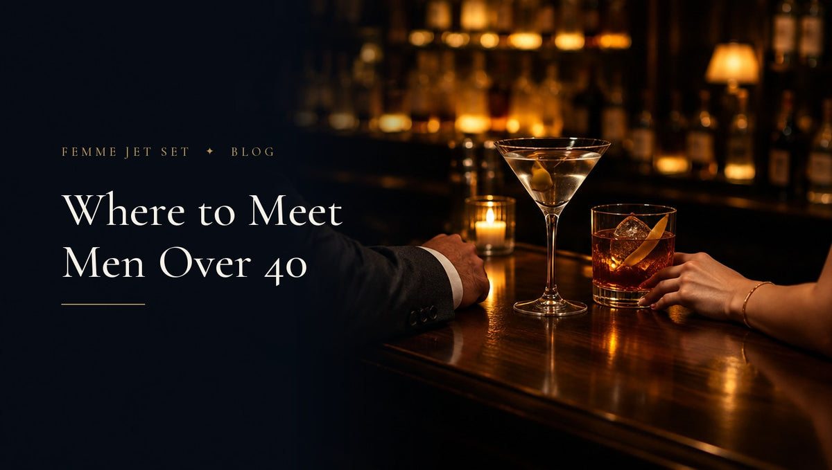 Martini and old fashioned on a dark walnut hotel bar by candlelight, a tailored sleeve and a hand with a gold bracelet, Where to Meet Men Over 40 cover